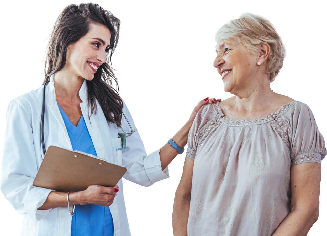 Smiling healthcare professional with clipboard reassuring an older female patient during a consultation.